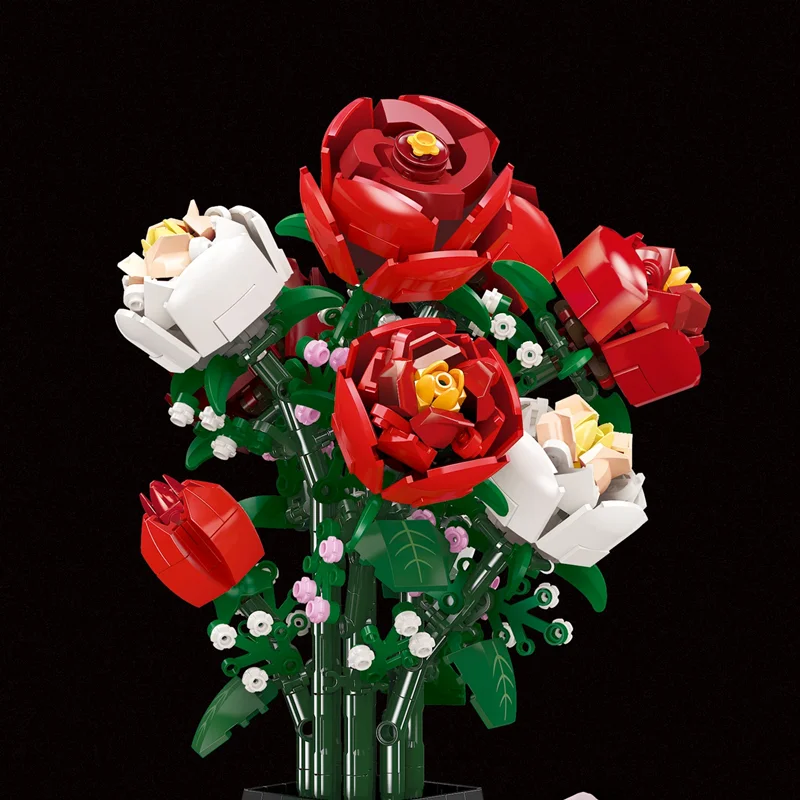 نمای نزدیک گلهای رز قرمز در لگو گلدان گل رز