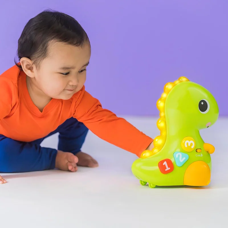 خرید اسباب بازی بریت استارتس «گربه GO Go Dino» دایناسور گوگو دینو  Bright Starts Go Go Dino Cat and Count Baby Toy P1321Bright Starts Go Go Dino Cat and Count Baby Toy P1321